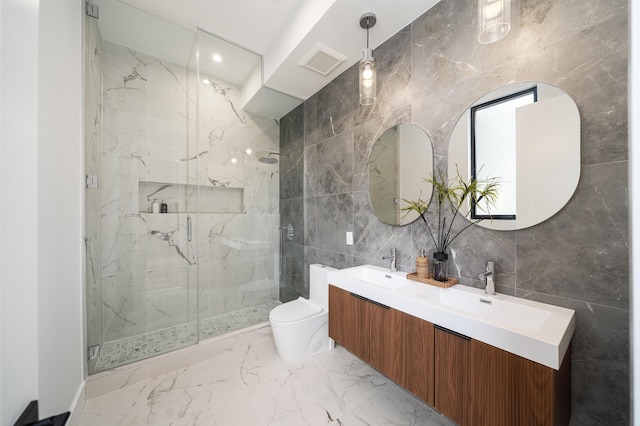 70 Gardner Ave Unit 2, Jersey City, NJ 07304 - bathroom with tile walls, a marble finish shower, double vanity, toilet, and marble tiled flooring