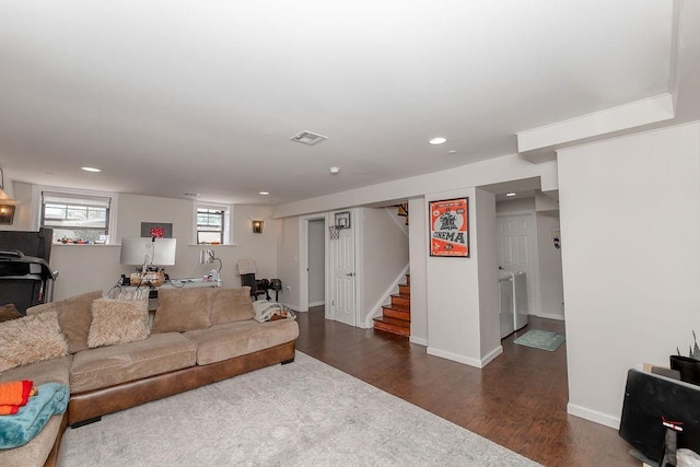 living room with visible vents, dark wood-style flooring, stairs, recessed lighting, and separate washer and dryer