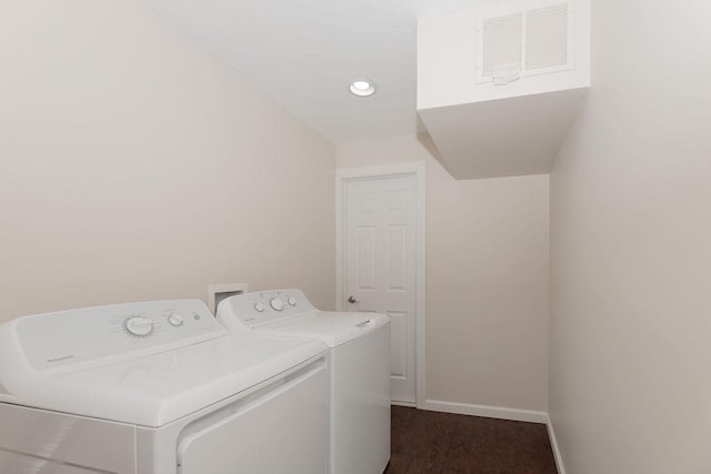 laundry room featuring separate washer and dryer, laundry area, recessed lighting, and baseboards