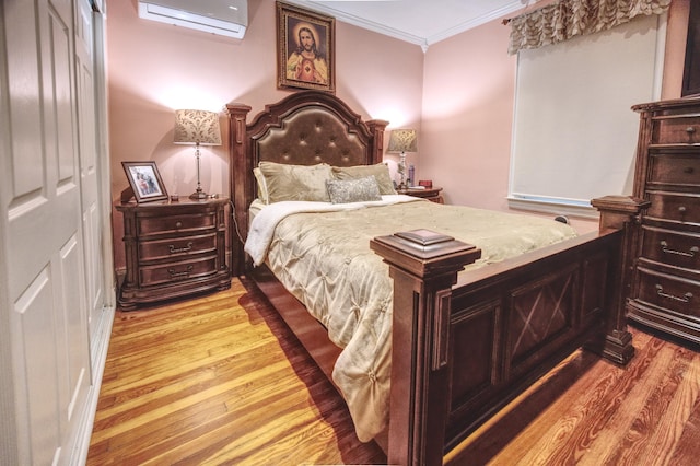 1404 81st St, North Bergen, NJ 07047 - bedroom with an AC wall unit, ornamental molding, and light wood finished floors