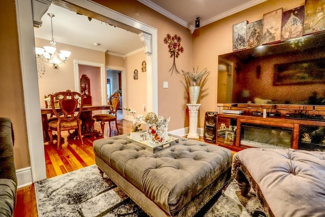 1404 81st St, North Bergen, NJ 07047 - living room featuring wood finished floors, a chandelier, crown molding, and baseboards