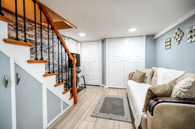 1404 81st St, North Bergen, NJ 07047 - living area featuring stairway, wood tiled floors, and recessed lighting