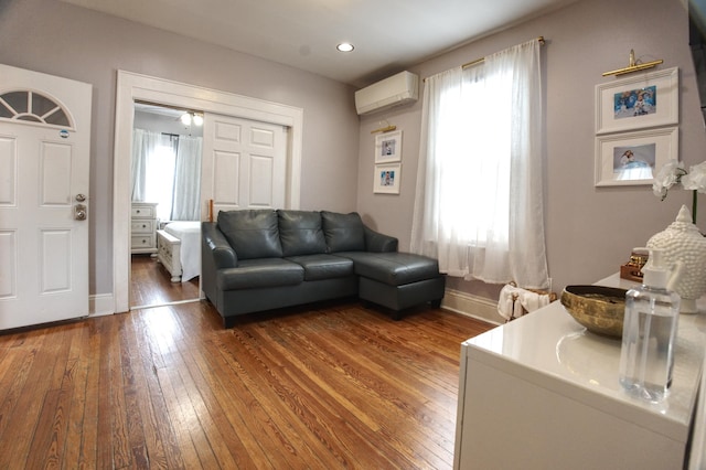 1404 81st St, North Bergen, NJ 07047 - living room featuring an AC wall unit, hardwood / wood-style flooring, baseboards, and recessed lighting