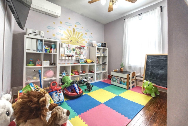 1404 81st St, North Bergen, NJ 07047 - recreation room featuring a wall mounted AC, hardwood / wood-style floors, and ceiling fan