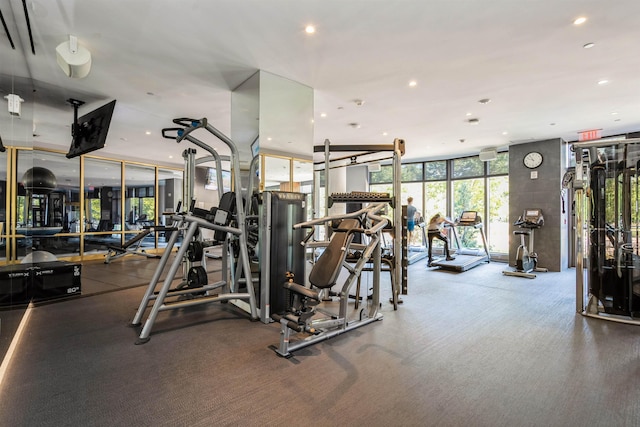 2 Shore Ln Unit 410, Jersey City, NJ 07310 - exercise room with a wall of windows and recessed lighting