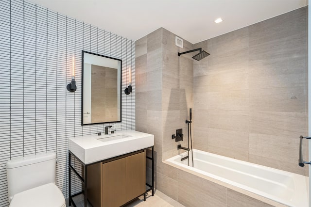 2 Shore Ln Unit 410, Jersey City, NJ 07310 - bathroom featuring tile walls, tiled shower / bath combo, and vanity
