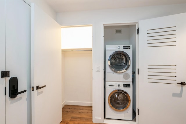 2 Shore Ln Unit 410, Jersey City, NJ 07310 - laundry area with stacked washer / drying machine and wood finished floors