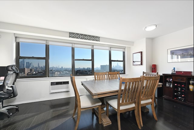 dining room with a wall mounted AC and dark hardwood / wood-style floors