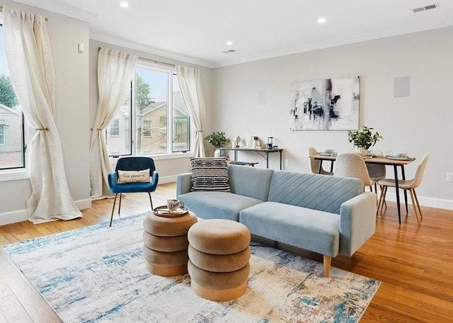 41 Graham St Unit 2, Jersey City, NJ 07307 - sitting room with wood finished floors, crown molding, baseboards, and recessed lighting