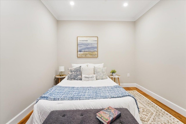 41 Graham St Unit 2, Jersey City, NJ 07307 - bedroom with crown molding, wood finished floors, baseboards, and recessed lighting