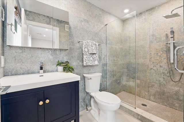 41 Graham St Unit 2, Jersey City, NJ 07307 - full bath featuring a stall shower, toilet, tile walls, tile patterned flooring, and vanity