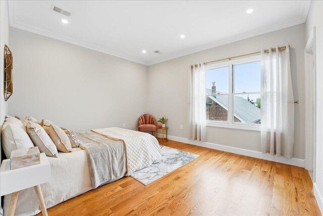 41 Graham St Unit 2, Jersey City, NJ 07307 - bedroom featuring baseboards, light wood finished floors, ornamental molding, and recessed lighting