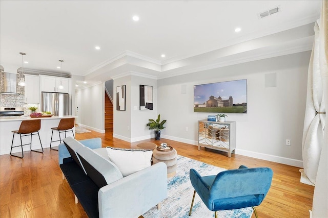 41 Graham St Unit 2, Jersey City, NJ 07307 - living room with stairway, recessed lighting, light wood finished floors, baseboards, and ornamental molding