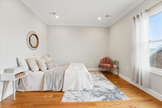 41 Graham St Unit 2, Jersey City, NJ 07307 - bedroom with crown molding, baseboards, wood finished floors, and recessed lighting
