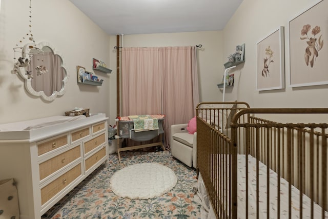 bedroom featuring a crib