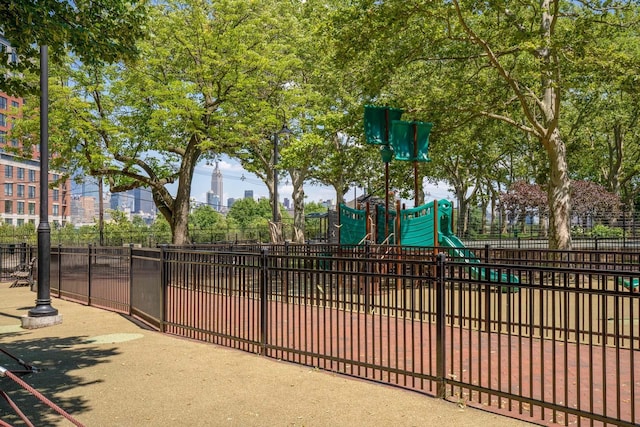 communal playground featuring fence