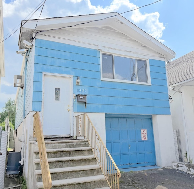 1437 Gehr Pl, North Bergen, NJ 07407 - view of front facade with an attached garage