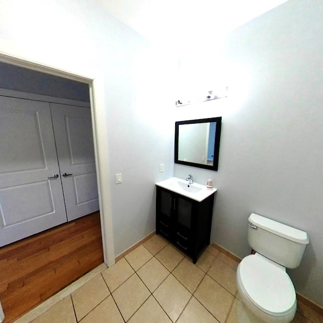 172 Culver Ave Unit 301, Jersey City, NJ 07305 - half bathroom with vanity, toilet, baseboards, and tile patterned flooring