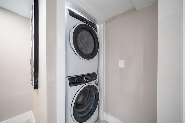 washroom with stacked washer and clothes dryer