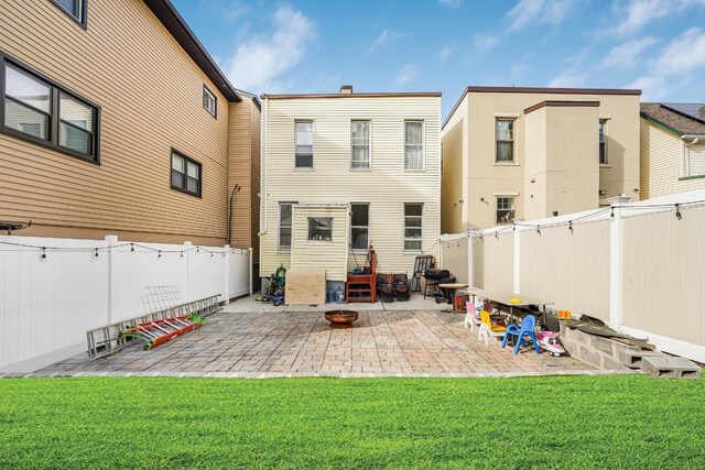 1527 38th St, North Bergen, NJ 07047 - back of property featuring a patio and a fire pit