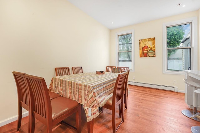 1527 38th St, North Bergen, NJ 07047 - dining space featuring a baseboard heating unit, light wood-style floors, recessed lighting, and baseboards