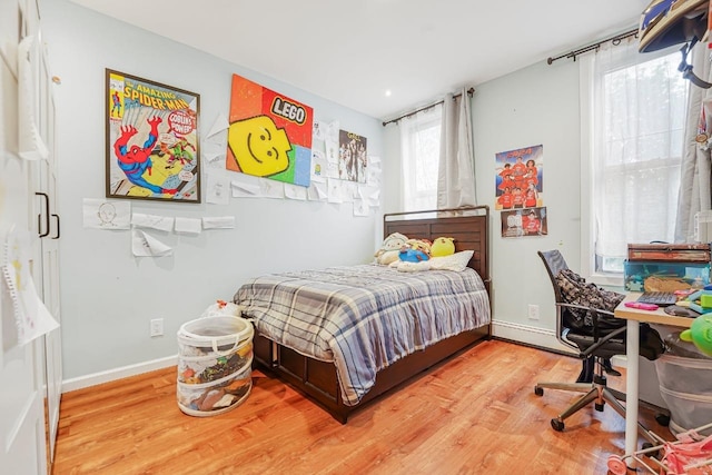 1527 38th St, North Bergen, NJ 07047 - bedroom with wood finished floors, a baseboard radiator, and baseboards