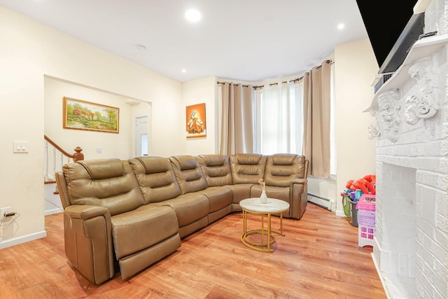 1527 38th St, North Bergen, NJ 07047 - living room featuring a baseboard radiator, light wood-style flooring, baseboards, recessed lighting, and stairway