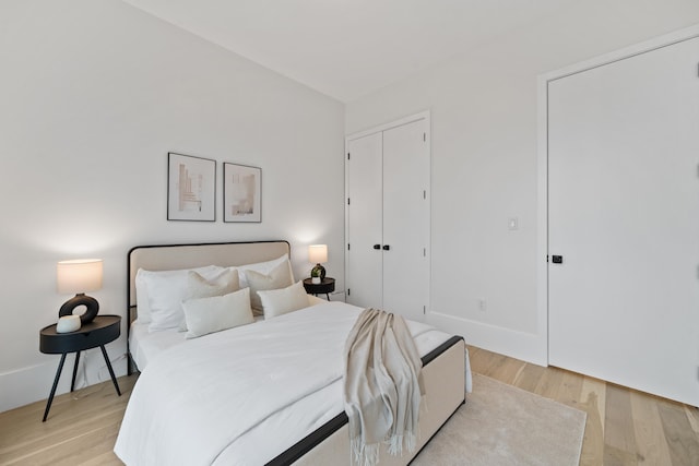 bedroom featuring a closet and light hardwood / wood-style floors