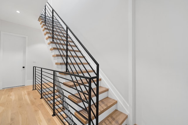 stairs with wood-type flooring