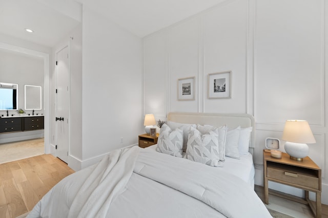 bedroom with light wood-type flooring