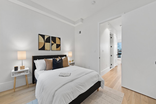 bedroom with light hardwood / wood-style floors