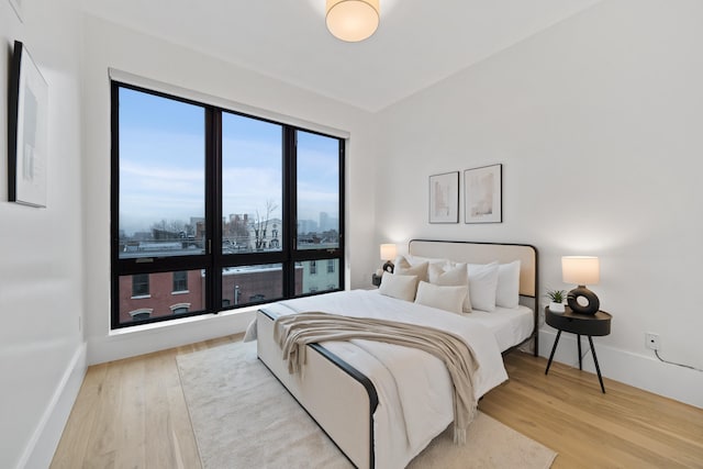 bedroom with hardwood / wood-style flooring