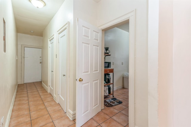 hall with light tile patterned flooring