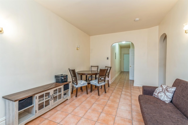 dining area with light tile patterned floors