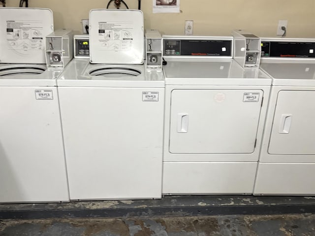 clothes washing area with washer and clothes dryer