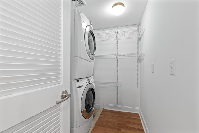 413 Madison St Unit 4, Hoboken, NJ 07030 - laundry room with stacked washer / drying machine and wood finished floors