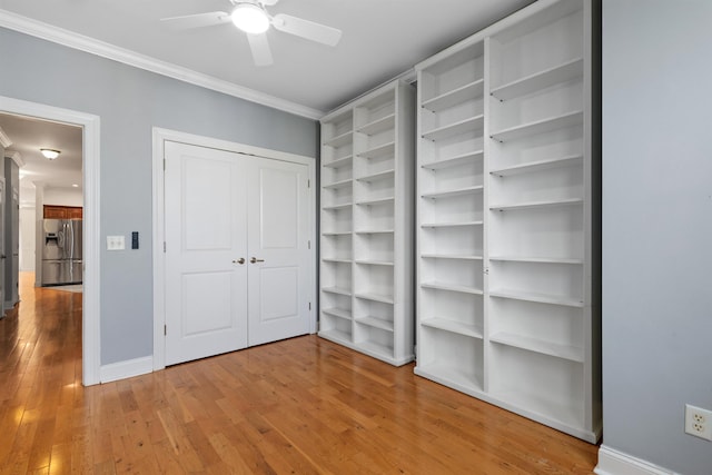 413 Madison St Unit 4, Hoboken, NJ 07030 - unfurnished bedroom featuring stainless steel refrigerator with ice dispenser, crown molding, wood finished floors, and a ceiling fan