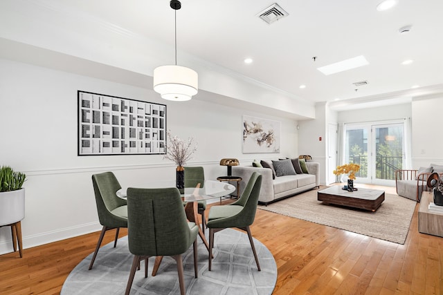 413 Madison St Unit 4, Hoboken, NJ 07030 - dining space with crown molding, light wood-style floors, recessed lighting, and a skylight