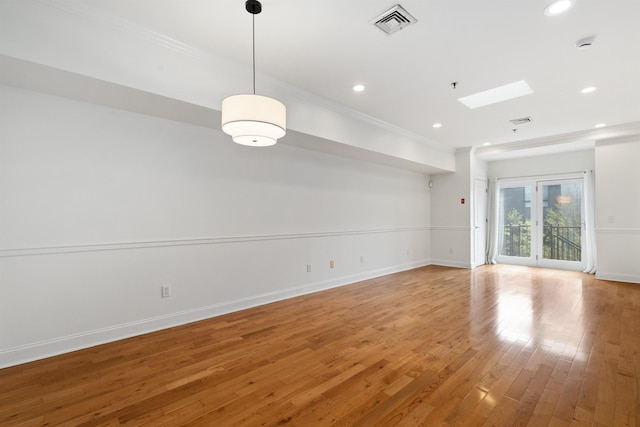 413 Madison St Unit 4, Hoboken, NJ 07030 - empty room featuring ornamental molding, recessed lighting, light wood-style floors, a skylight, and a smoke detector