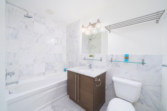 full bathroom with vanity, tile walls,  shower combination, and toilet