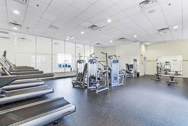 exercise room featuring a drop ceiling