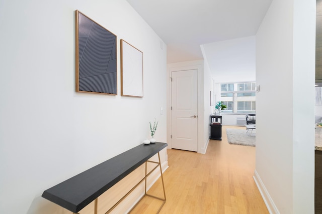 corridor featuring hardwood / wood-style floors