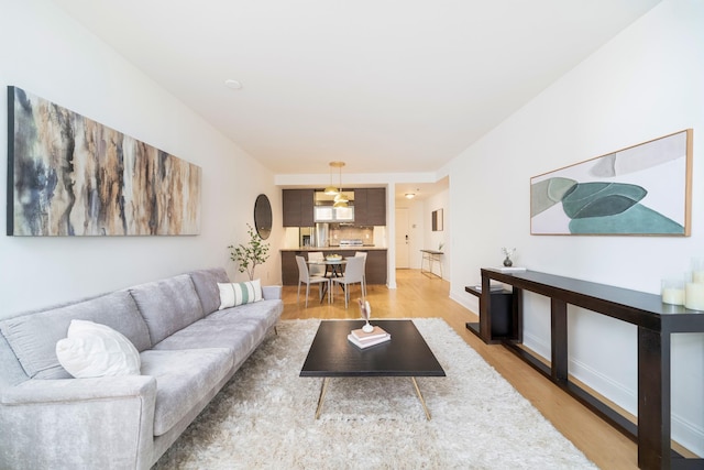 living room with light hardwood / wood-style flooring