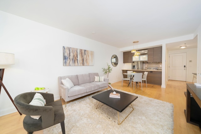 living room with light hardwood / wood-style flooring