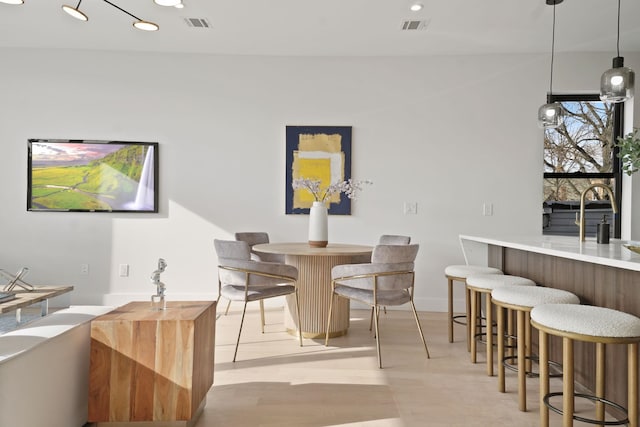 dining space featuring wet bar