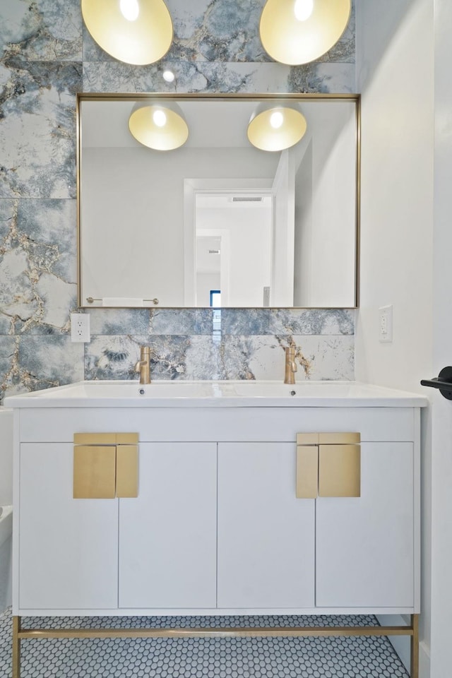 bathroom with vanity and backsplash