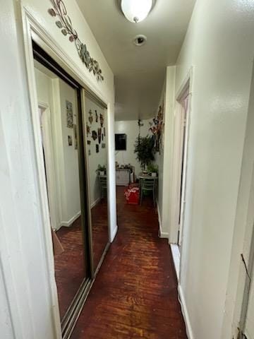 hallway with dark wood-type flooring