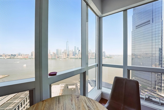 77 Hudson St Unit 3306, Jersey City, NJ 07302 - sunroom / solarium with a skyline view, a water view, and plenty of natural light