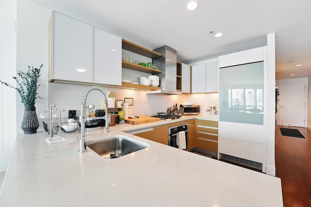 77 Hudson St Unit 3306, Jersey City, NJ 07302 - kitchen featuring stainless steel appliances, a sink, light countertops, open shelves, and ventilation hood