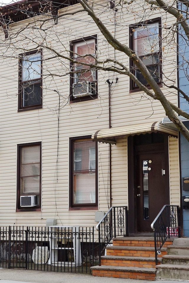 34 Concord St, Jersey City, NJ 07306 - view of front facade featuring cooling unit and a fenced front yard